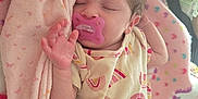Brayleanna is registered to the contest to win money with this photo: baby, blanket, child, closeup, comfort, cozy, cute, face, hair, hand, indoor, infant, newborn, onesie, pacifier, pink, rainbow_pattern, resting, sleeping, soft