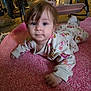 Brayleanna is registered to the contest to win money with this photo: baby, child, infant, pink_rug, floral_onesie, blue_eyes, floor, carpet, indoor, furniture, boots, socks, portrait, cute, crawling, young_child, person, home, cozy, curious
