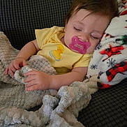 Brayleanna is registered to the contest to win money with this photo: baby, pacifier, sleeping, blanket, yellow_onesie, duck_embroidery, couch, fleece_blanket, hand, face, infant, resting, peaceful, soft_texture, colorful, cozy, indoors, child, portrait, comfort