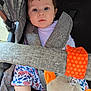 Brayleanna is registered to the contest to win money with this photo: baby, child, stroller, seatbelt, plush_toy, orange, blue_eyes, curly_hair, floral_pants, white_shirt, infant, outdoor, fabric, safety_strap, cute, portrait, looking, seated, baby_toy, closeup