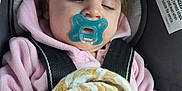 Brayleanna joined the competition — help win amazing prizes! baby, child, pacifier, car_seat, blanket, pink_clothing, sleeping, hoodie, infant, seatbelt, face, peaceful, young_child, resting, indoors, cute, comfort, safety, person, toddler