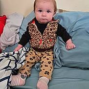 Brayleanna joined the competition — help win amazing prizes! baby, infant, child, sitting, leopard_print, vest, pants, pink_socks, bow, blanket, couch, indoor, clothing, cute, face, portrait, hand, feet, expression, blue