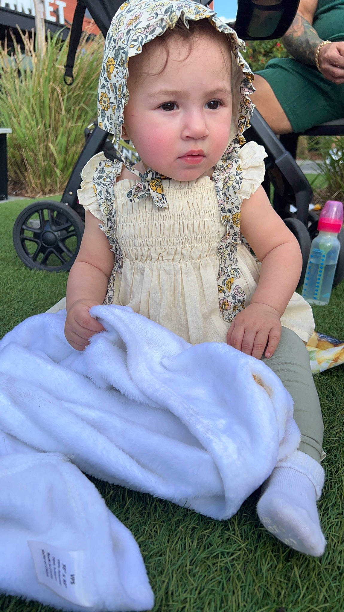 Kara joined the competition — help win amazing prizes! baby, baby_toddler_clothing, chair, child, dress, event, eye, fashion_accessory, grass, green, hair_accessory, happy, head, headpiece, jewellery, person, pink, plant, sitting, toddler