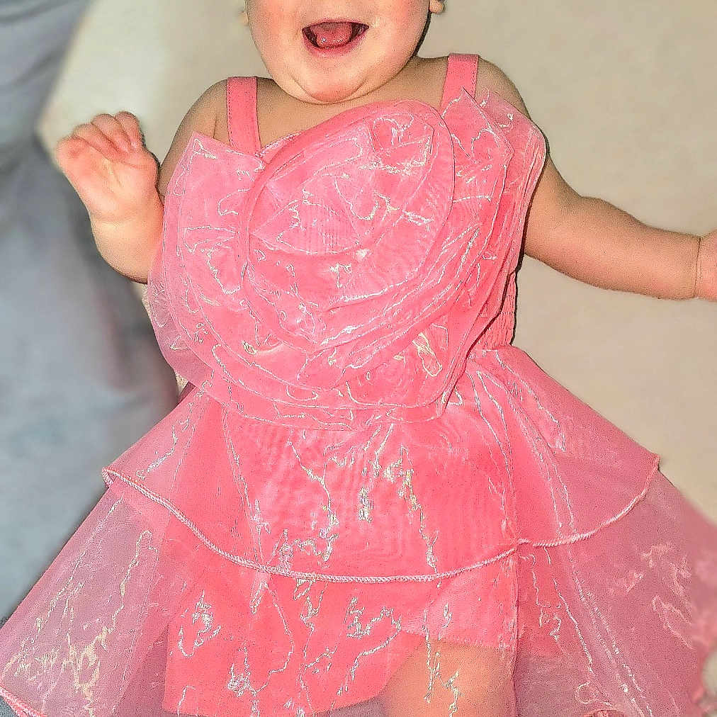 Aylie participe au concours pour gagner de l'argent avec cette photo : arms, baby, bare_feet, blanket, bow, child, clothing, cute, eyes, fabric, face, happy, headband, infant, legs, pink_dress, portrait, rosy_cheeks, smiling, toes