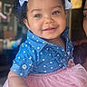 child, toddler, smiling, blue_shirt, heart_pattern, pink_tutu, hair_bows, curly_hair, indoor, portrait, happy, cute, fashion, person, baby, clothing, face, skin, holding, joyful