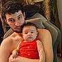 Amber joined the competition — help win amazing prizes! baby, chair, child, cozy, cuddling, curly_hair, facial_hair, family, hearts, holding, indoor, infant, love, man, person, portrait, red_dress, shirtless, skin, tenderness