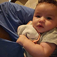 Amber is registered to the contest to win money with this photo: arm, baby, blanket, blue_fabric, casual, child, closeup, cloth, comfort, curly_hair, cute, face, fan, household_items, indoor, infant, person, skin, soft_toy, toddler