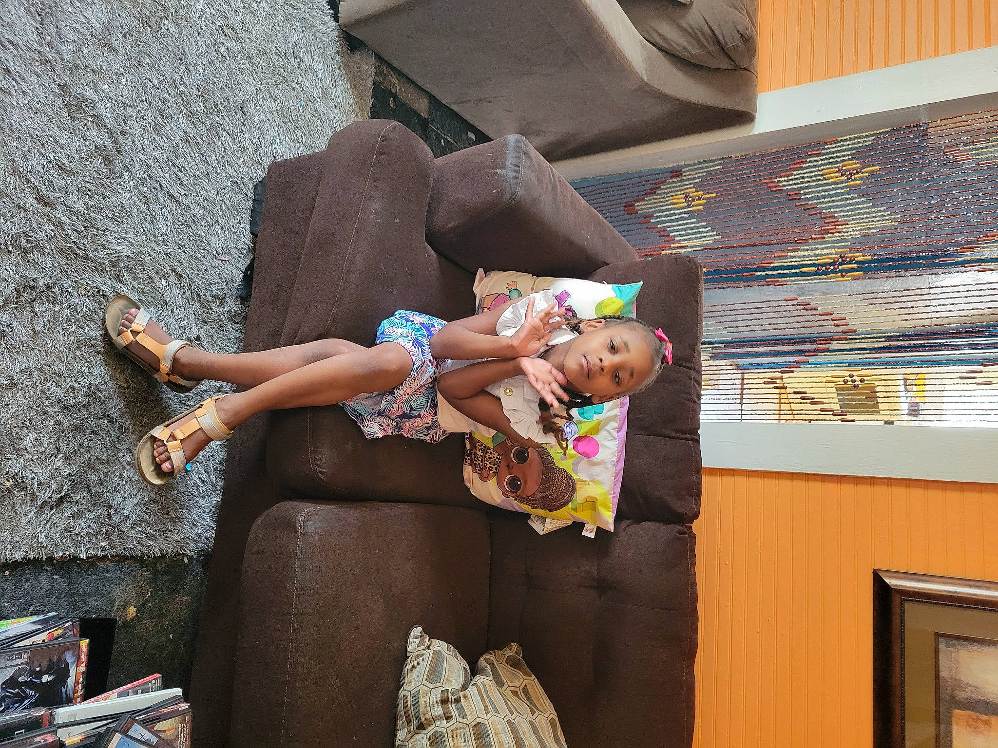 K'Niyah joined the competition — help win amazing prizes! child, foot, fun, hat, human_leg, leg, leisure, person, sandal, shorts, sidewalk, sitting, temple, textile, thigh, toddler, tourism, vacation, visual_arts, wall