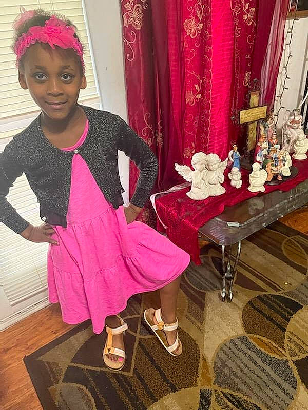 K'Niyah joined the competition — help win amazing prizes! baby_toddler_clothing, beauty, coffee_table, curtain, dress, embellishment, event, fashion, fashion_design, flooring, formal_wear, happy, joy, leg, magenta, person, pink, red, sleeve, smile