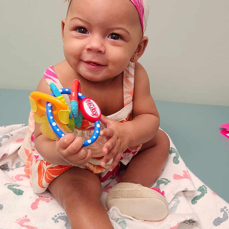 Lawriel is registered to the contest to win money with this photo: baby, bodypart, clothing, cream, dessert, face, finger, footwear, hand, happy, hat, head, hosiery, person, photography, portrait, shoe, sitting, smile, sock