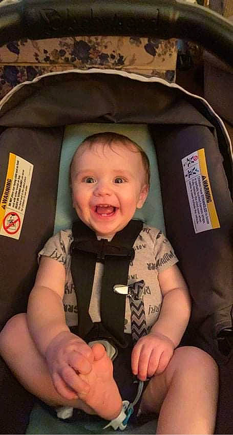 Raylan joined the competition — help win amazing prizes! baby, baby_carriage, baby_in_car_seat, baby_products, baby_toddler_clothing, black, car_seat, cheek, comfort, eye, finger, fun, gesture, happy, mouth, organ, person, product, seat_belt, smile