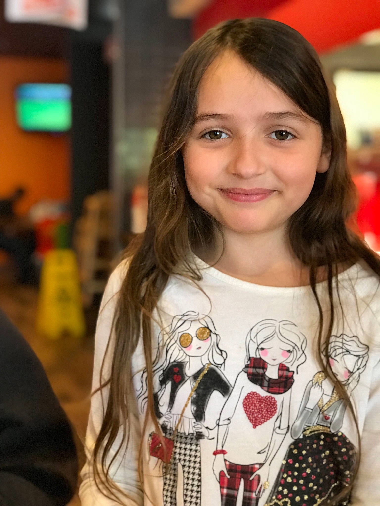 Joy is registered to the contest to win money with this photo: black_hair, brown_hair, child, fashion, fawn, hair, hairstyle, joy, lip, long_hair, person, smile, t_shirt