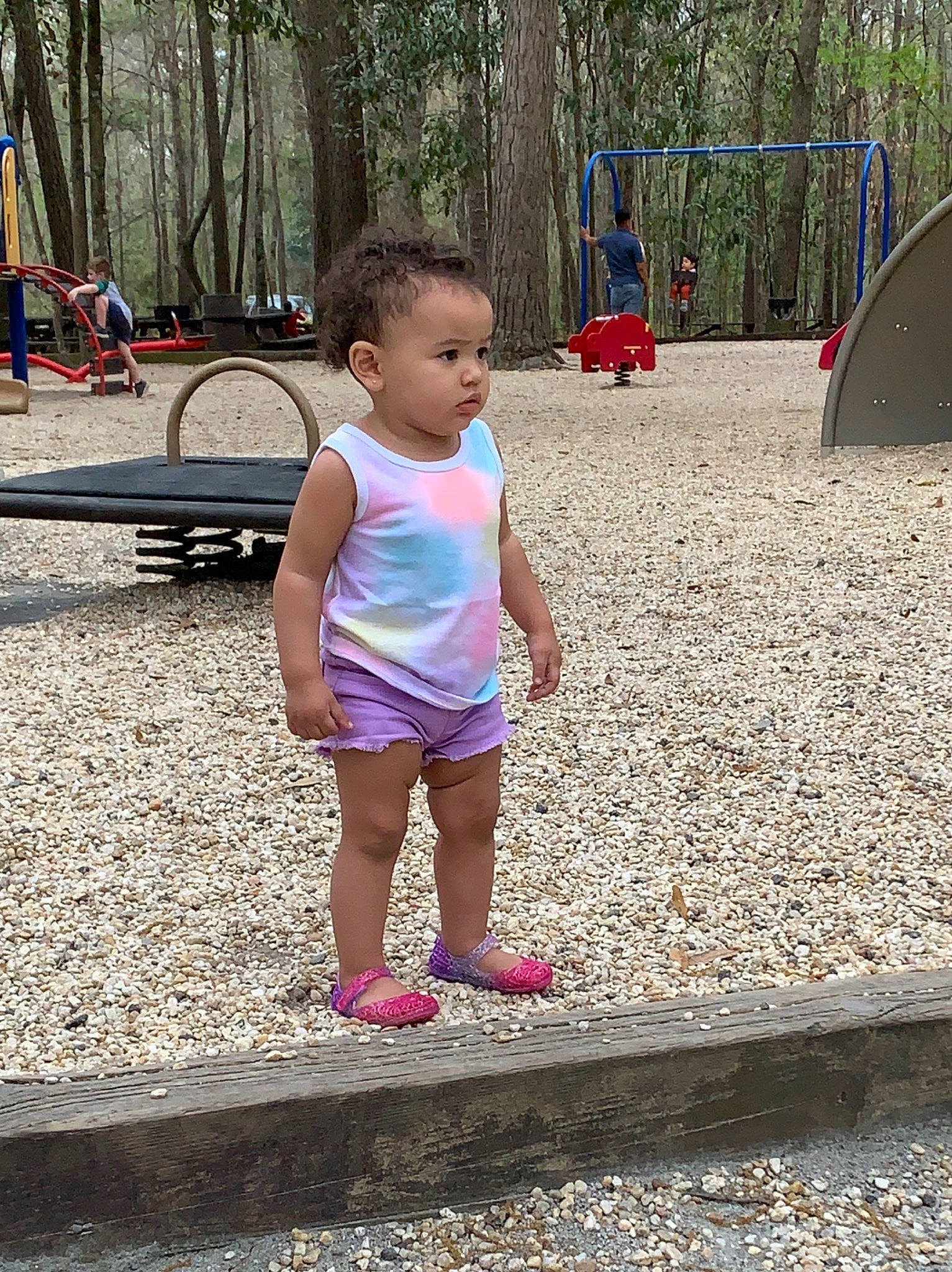 Serenity is registered to the contest to win money with this photo: child, city, fun, human_settlement, leg, leisure, outdoor_play_equipment, park, person, pink, play, playground, public_space, recreation, shorts, smile, spring, summer, toddler, tree