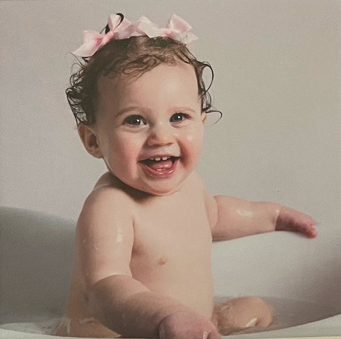 Hannah is registered to the contest to win money with this photo: arm, baby_bathing, bathroom, bathtub, cheek, chin, ear, eye, eyebrow, eyelash, hair, hairstyle, happy, jaw, lip, neck, organ, person, skin, smile