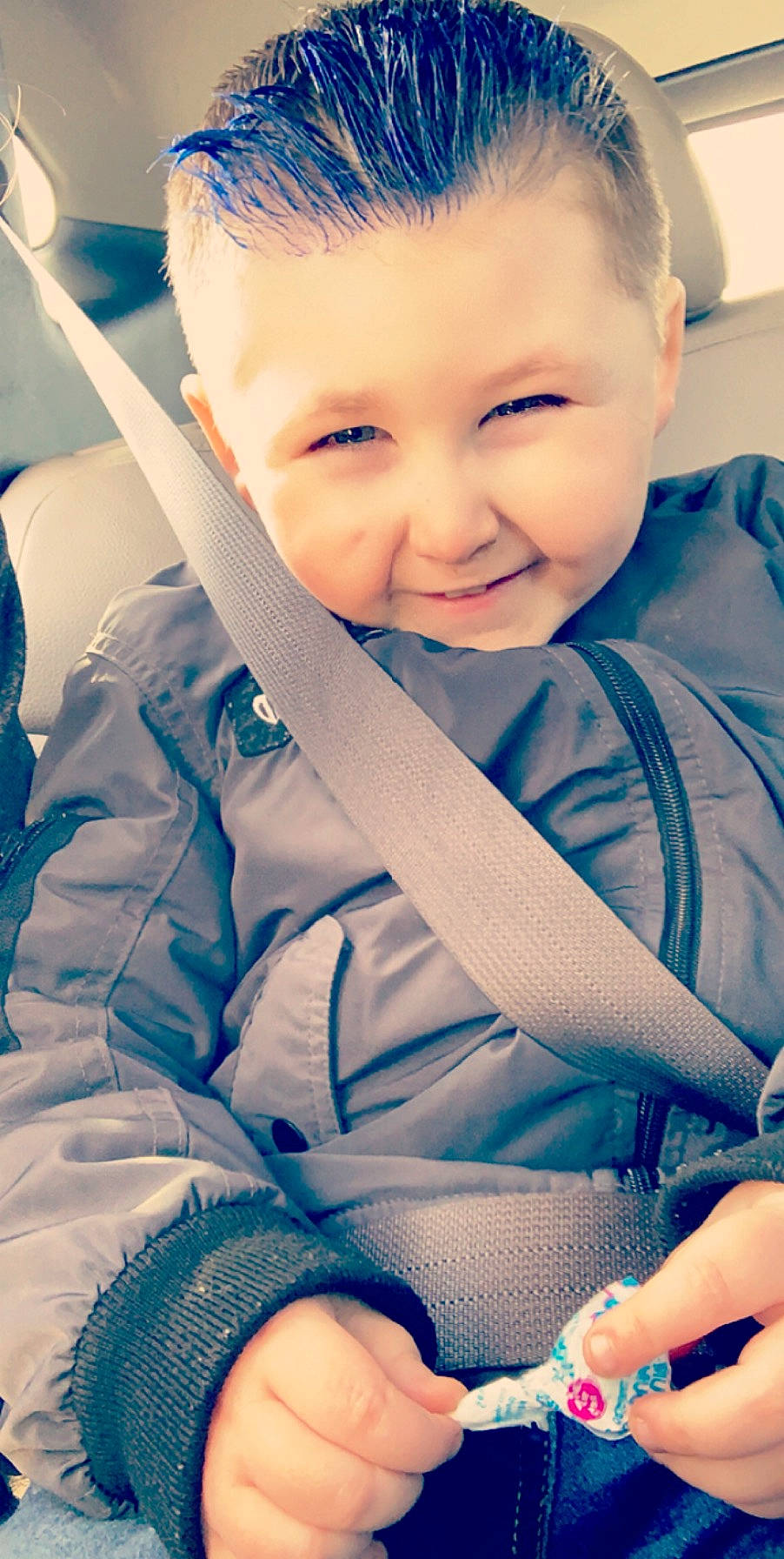 Bentley is registered to the contest to win money with this photo: baby, blue, cheek, child, chin, eye, face, facial_expression, forehead, happy, head, joy, leg, lip, nose, outerwear, person, product, sitting, skin