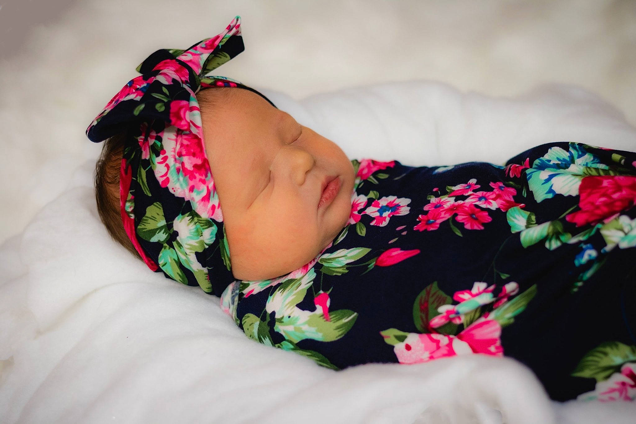 Laynie is registered to the contest to win money with this photo: baby, baby_toddler_clothing, child, hair_accessory, nap, person, pink, plant, sleep, textile, toddler