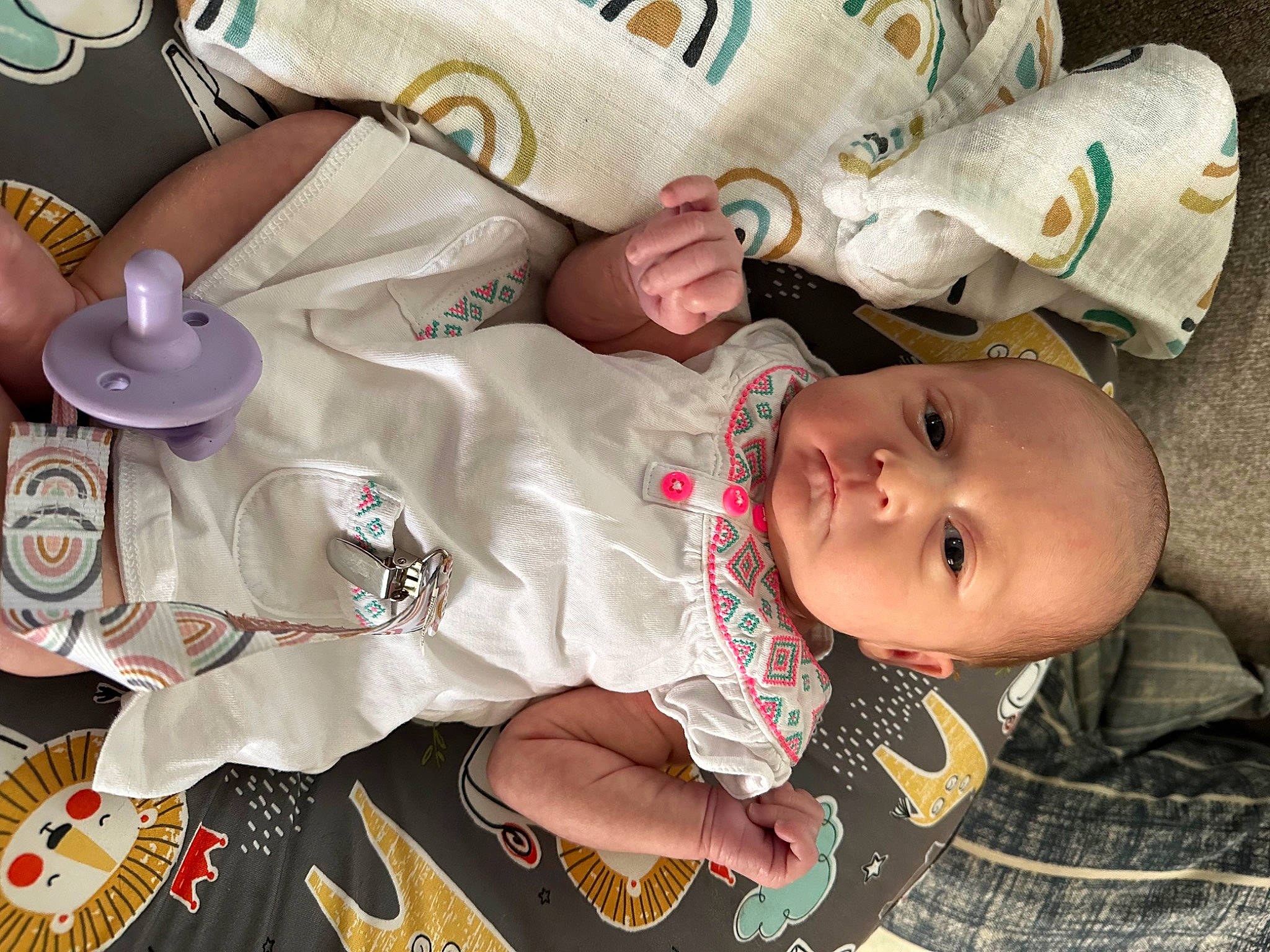 Saylor is registered to the contest to win money with this photo: baby, baby_carriage, baby_products, baby_toddler_clothing, cheek, child, comfort, mouth, nail, pattern, person, room, sitting, skin, textile, toddler, wood