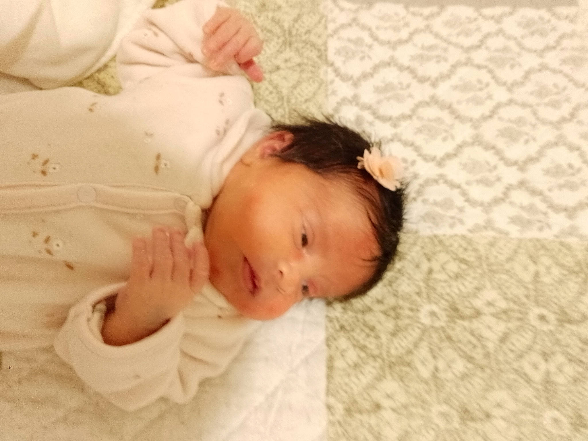 Isrâa participe au concours pour gagner de l'argent avec cette photo : baby, baby_toddler_clothing, cheek, child, comfort, eye, eyelash, finger, grass, happy, hardwood, head, linens, nose, pattern, person, skin, sleeve, textile, toddler