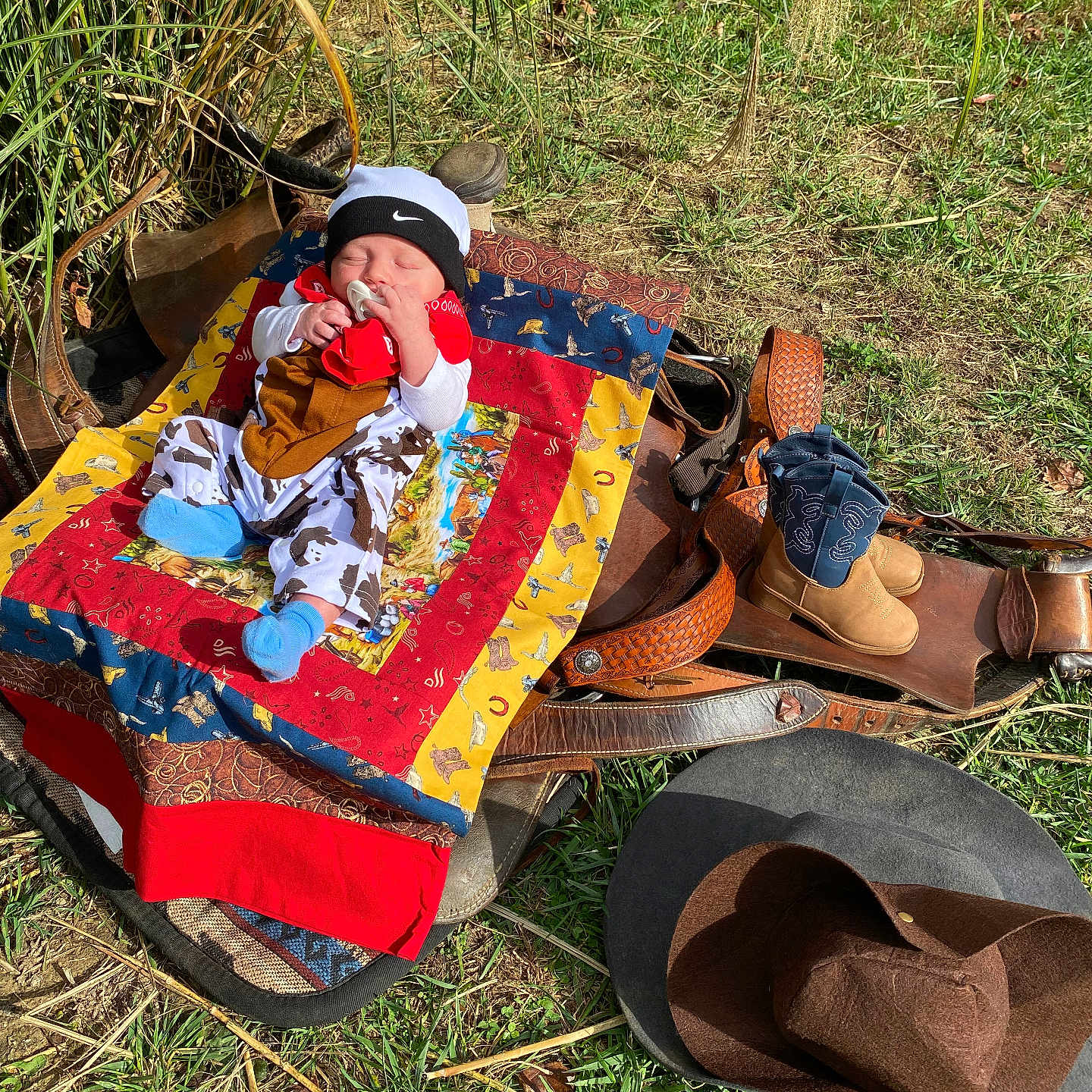 Waylon is registered to the contest to win money with this photo: baby, clothing, costume, face, footwear, grass, hat, head, hosiery, nature, outdoors, park, person, photography, plant, portrait, shoe, sock, summer, sunhat