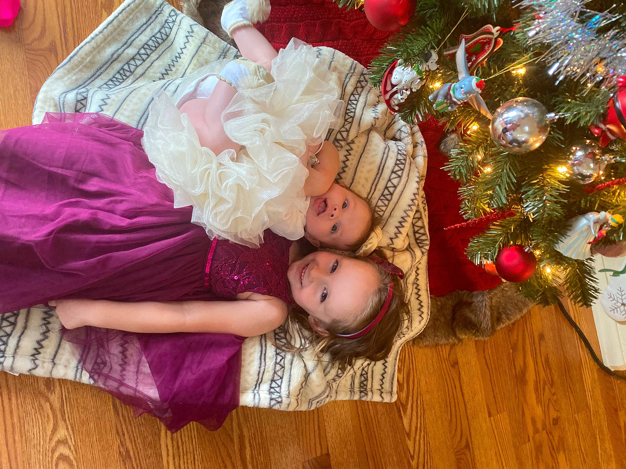 Charlotte joined the competition — help win amazing prizes! baby, baby_toddler_clothing, child, christmas_ornament, christmas_tree, dress, event, flooring, happy, hardwood, headpiece, joy, magenta, pattern, person, pink, plant, smile, toddler, tradition