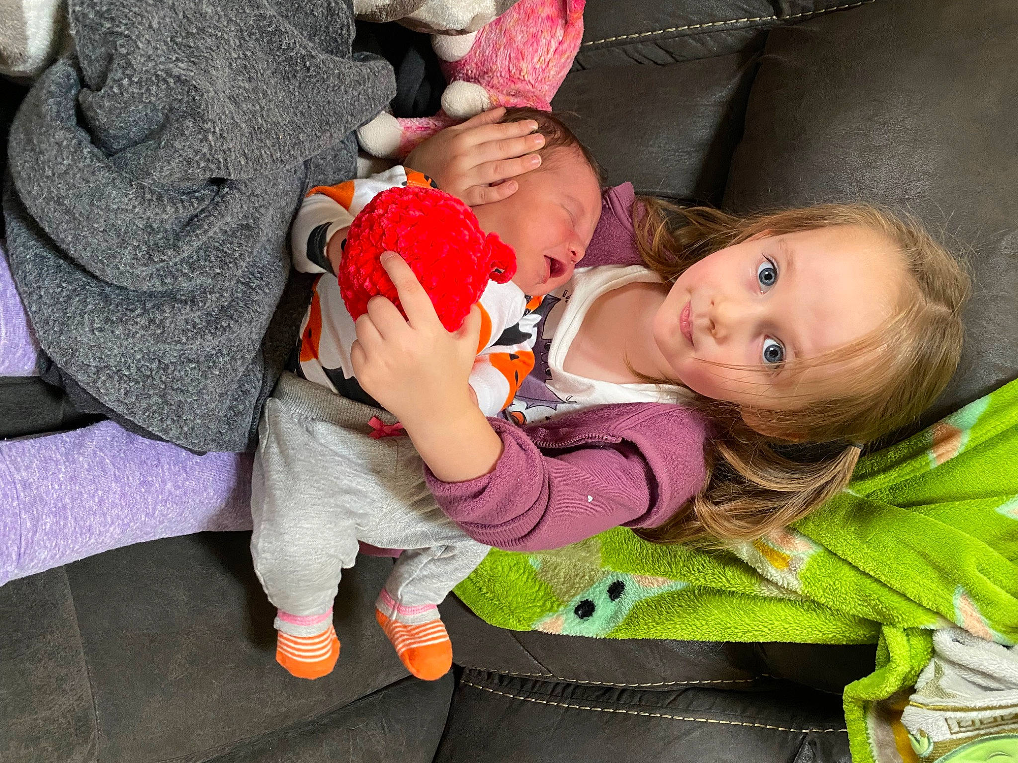 Charlotte is registered to the contest to win money with this photo: baby, baby_products, baby_toddler_clothing, carmine, cheek, child, event, fun, grass, happy, lap, leaf, pattern, person, pink, sitting, skin, sock, textile, toddler