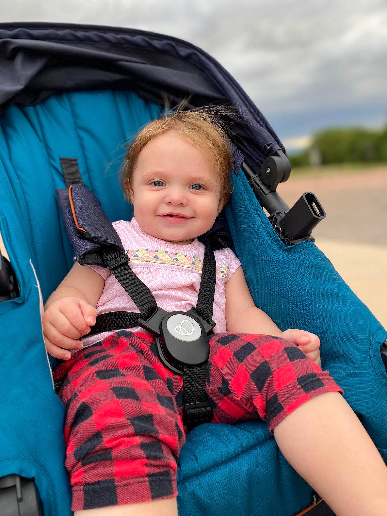 Vivianne is registered to the contest to win money with this photo: baby_carriage, blue, cloud, cool, electric_blue, flash_photography, fun, happy, joy, leisure, people, person, plaid, plant, recreation, skin, sky, smile, tartan, toddler