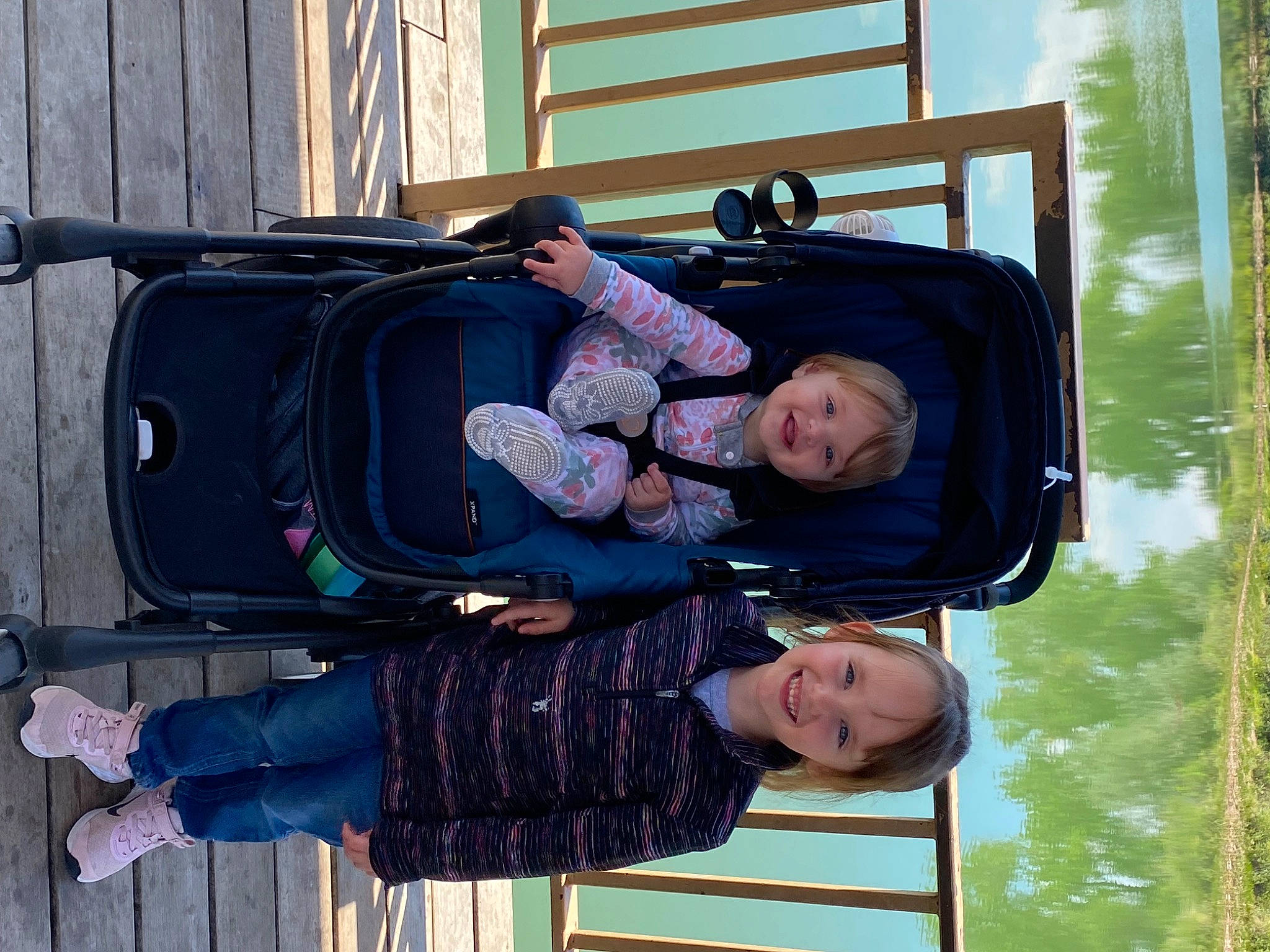 Vivianne is registered to the contest to win money with this photo: baby, baby_toddler_clothing, black, child, comfort, fun, happy, joy, leisure, person, sky, smile, toddler, travel, tree, vehicle