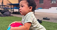 Enma joined the competition — help win amazing prizes! toddler, child, volleyball, grass, outdoor, curly_hair, kneeling, play, toy, casual_clothing, daytime, background_blur, building, umbrella, sports, young_child, cute, summer, natural_light, portrait
