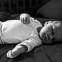 Lyanna participe au concours pour gagner de l'argent avec cette photo : baby, black_and_white, calm, child, clothing, cozy, cute, face, hand, indoors, infant, lying_down, monochrome, newborn, peaceful, portrait, relaxation, rest, sleeping, soft_surface