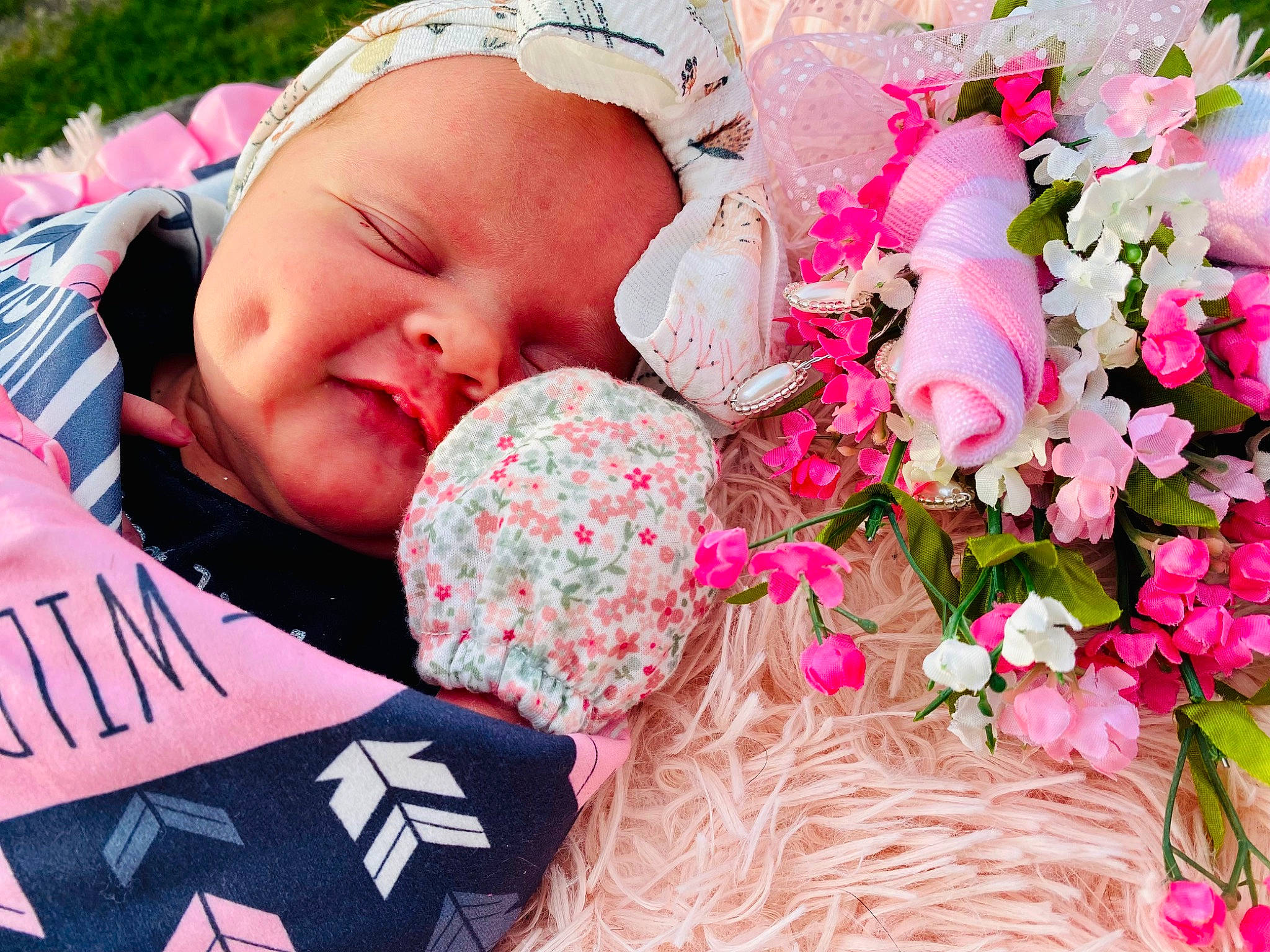Chandler is registered to the contest to win money with this photo: baby, baby_toddler_clothing, beauty, comfort, flower, flower_arranging, grass, happy, linens, lip, magenta, pattern, people_in_nature, person, petal, pink, plant, rose_family, spring, textile