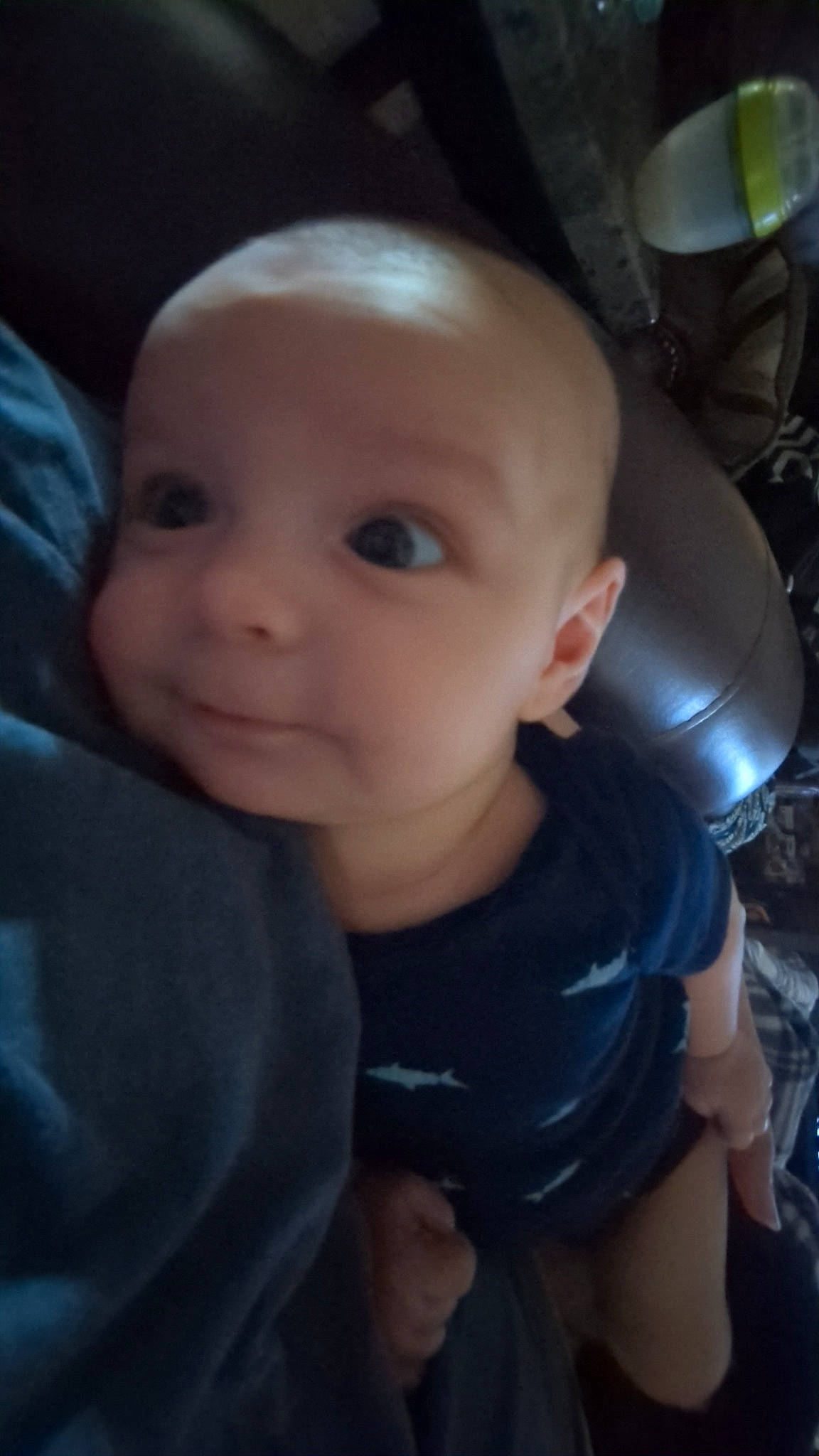 Elijah is registered to the contest to win money with this photo: auto_part, baby, baby_toddler_clothing, car_seat, cheek, chest, child, comfort, electric_blue, eyelash, flash_photography, fun, iris, nail, nose, person, personal_protective_equipment, sitting, skin, thumb