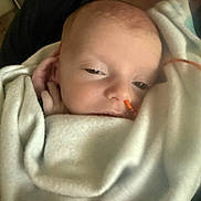 Ryann is registered to the contest to win money with this photo: baby, blanket, face, person, sleepy, infant, skin, hand, comfort, rest, newborn, human, cuddle, closeup, soft, warm, healthcare, indoors, portrait, tubing