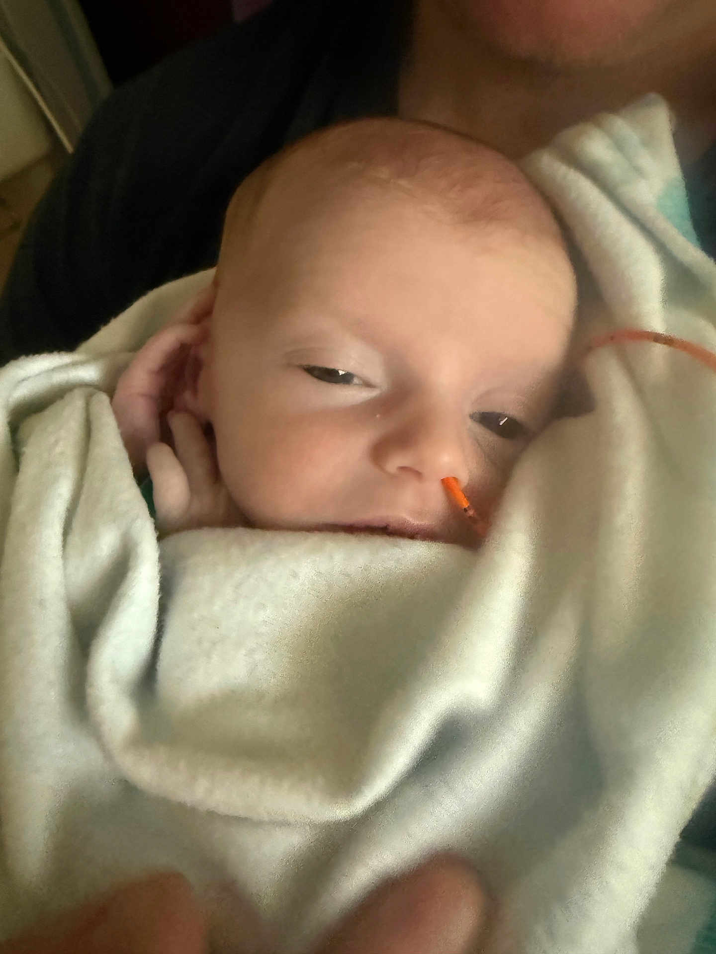Ryann is registered to the contest to win money with this photo: baby, blanket, face, person, sleepy, infant, skin, hand, comfort, rest, newborn, human, cuddle, closeup, soft, warm, healthcare, indoors, portrait, tubing