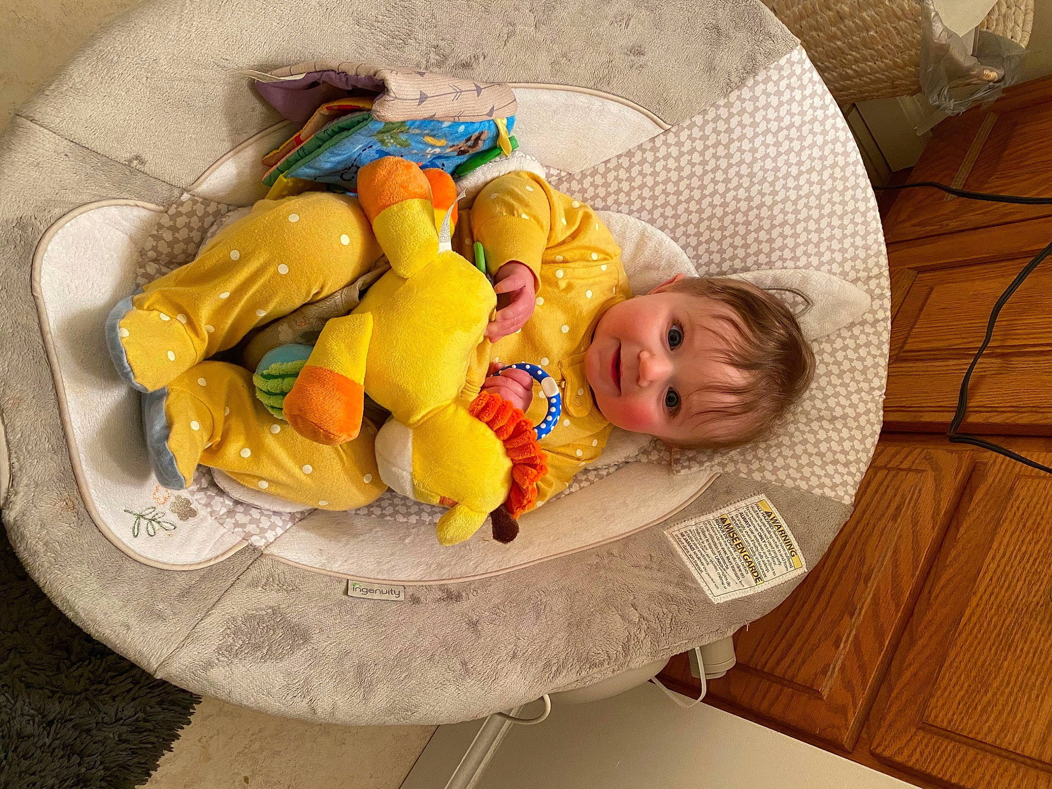 Olivia is registered to the contest to win money with this photo: baby, baby_products, baby_toys, child, comfort, comfort_food, couch, flooring, hardwood, leisure, linens, orange, person, play, room, stuffed_toy, table, toddler, toy, wicker