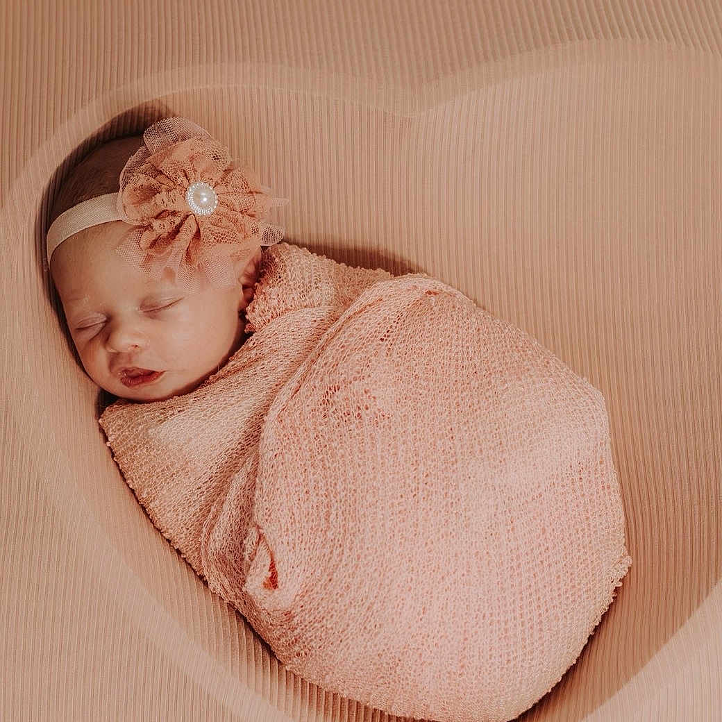 Rose Boatwright is registered to the contest to win money with this photo: baby, blanket, closed_eyes, cozy, face, flower, headband, indoors, infant, newborn, newborn_photography, peaceful, photography, pink, portrait, resting, sleeping, soft_lighting, swaddled, textile