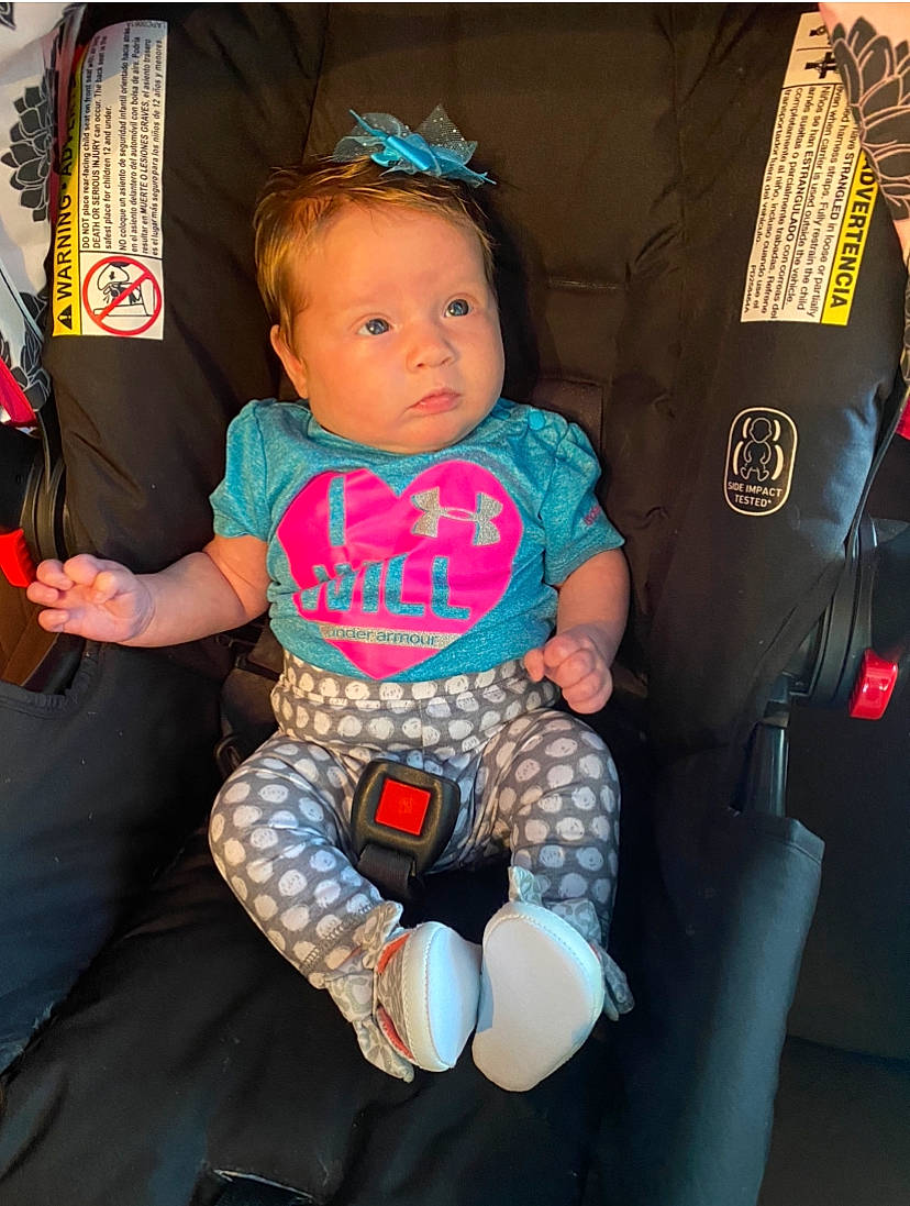 Cora joined the competition — help win amazing prizes! baby, baby_carriage, baby_products, baby_toddler_clothing, car_seat, child, comfort, cool, electric_blue, finger, fun, human_leg, knee, lap, pattern, person, sitting, stuffed_toy, t_shirt, thigh