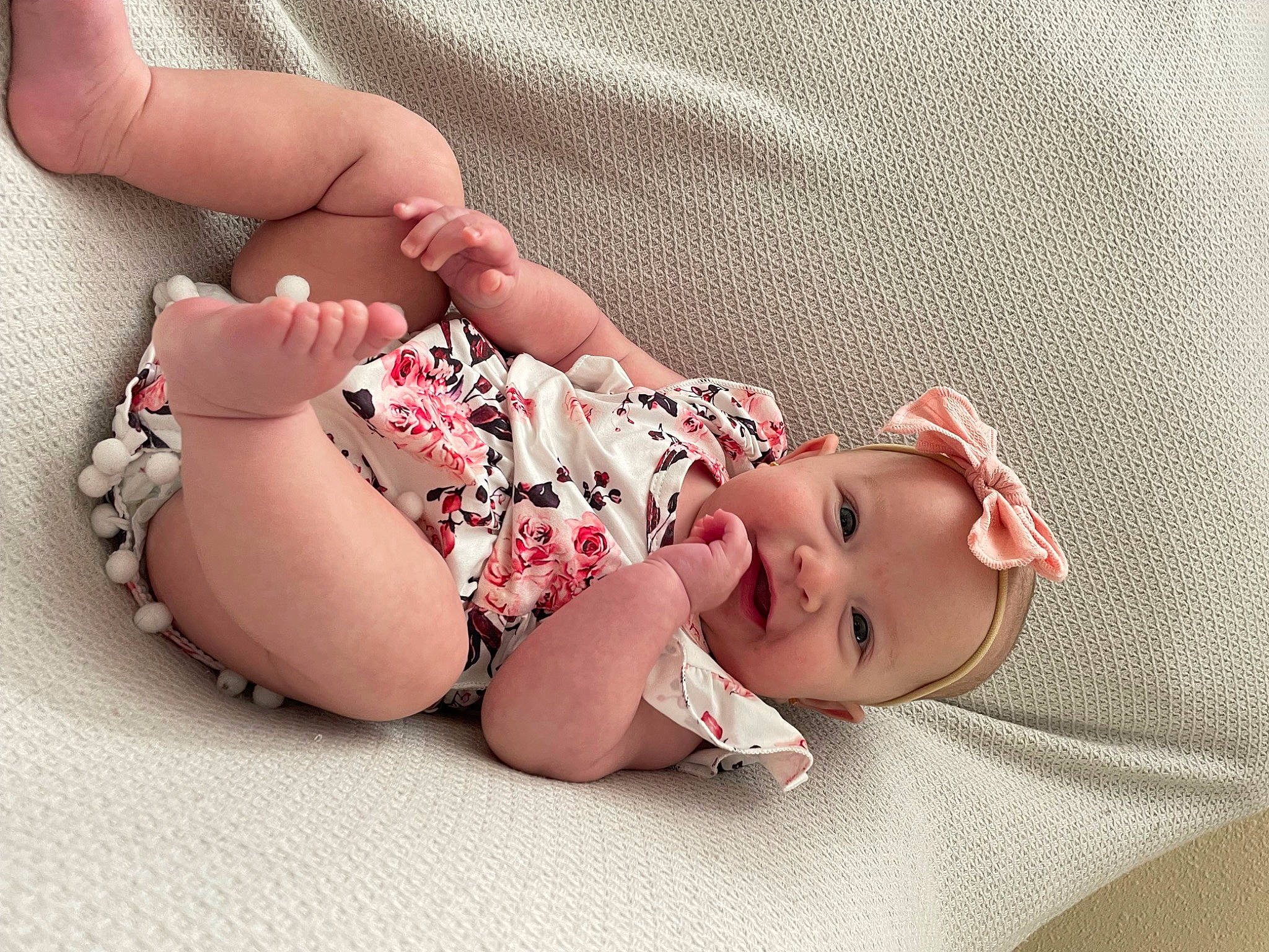 Emersyn is registered to the contest to win money with this photo: baby, baby_sleeping, baby_toddler_clothing, cheek, comfort, finger, foot, hand, headgear, human_body, leg, lip, mouth, pattern, person, pink, product, skin, sleeve, thigh