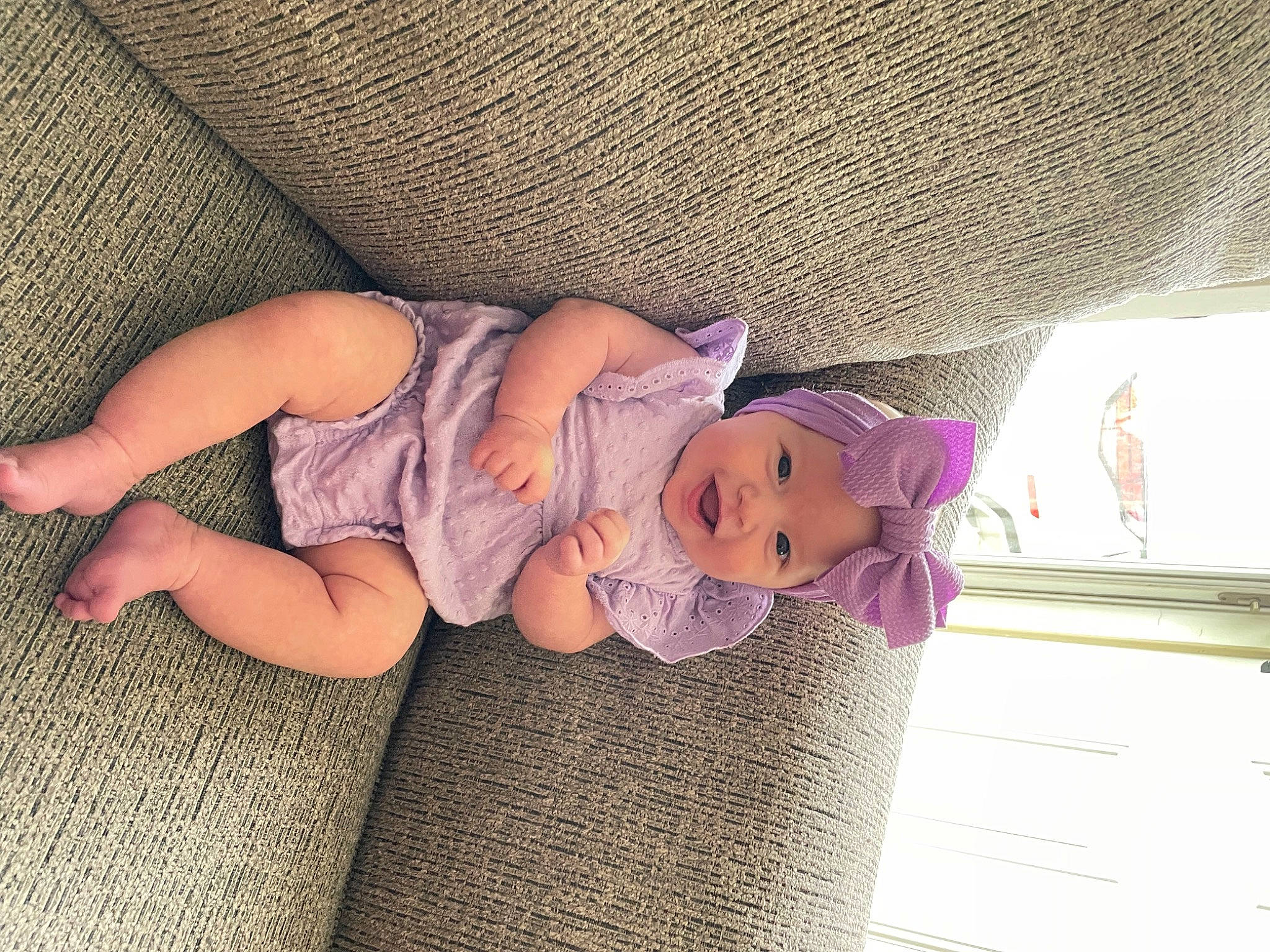 Emersyn is registered to the contest to win money with this photo: baby, baby_products, baby_sleeping, baby_toddler_clothing, child, comfort, doll, finger, foot, headwear, human_leg, leg, linens, mammal, person, pink, purple, sock, thigh, toddler