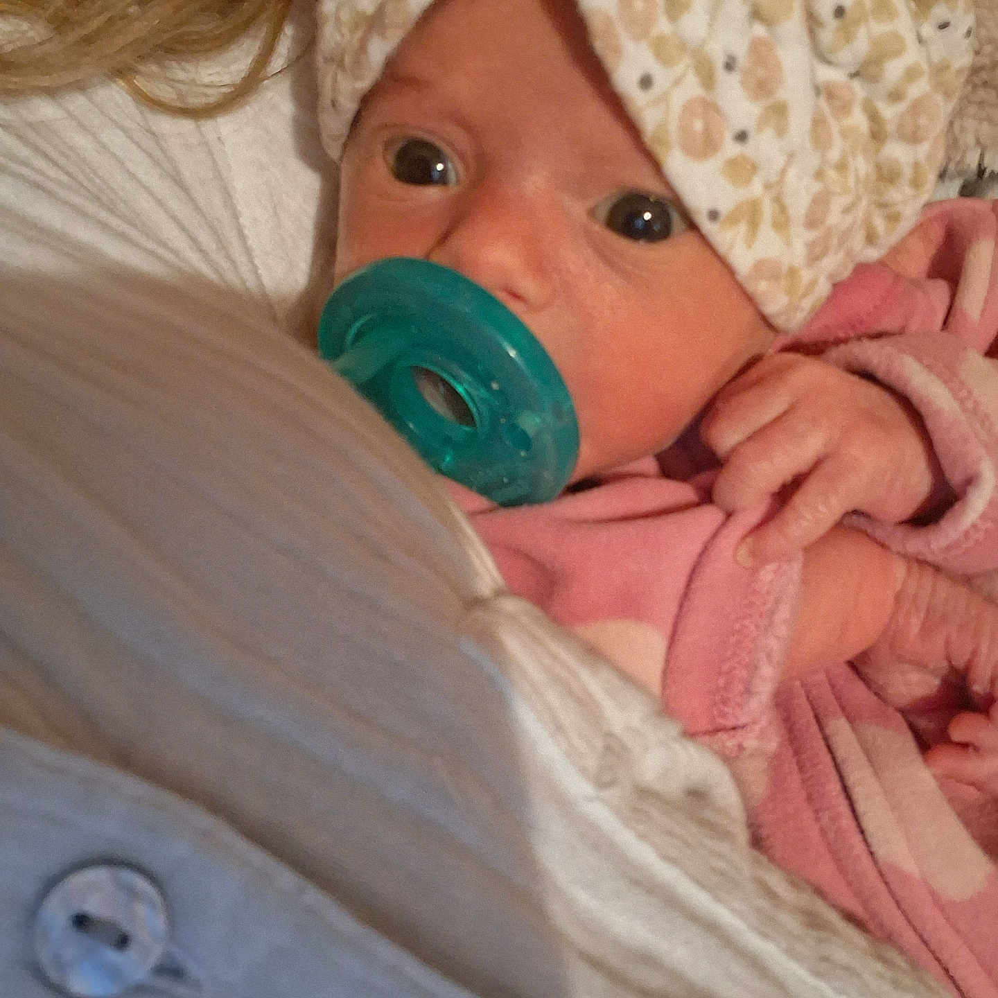 Raelynn joined the competition — help win amazing prizes! adult, baby, closeup, comfort, cozy, cute, expression, face, hand, headwrap, holding, indoor, infant, newborn, pacifier, pink_pajamas, portrait, skin, sleepwear, white_clothing