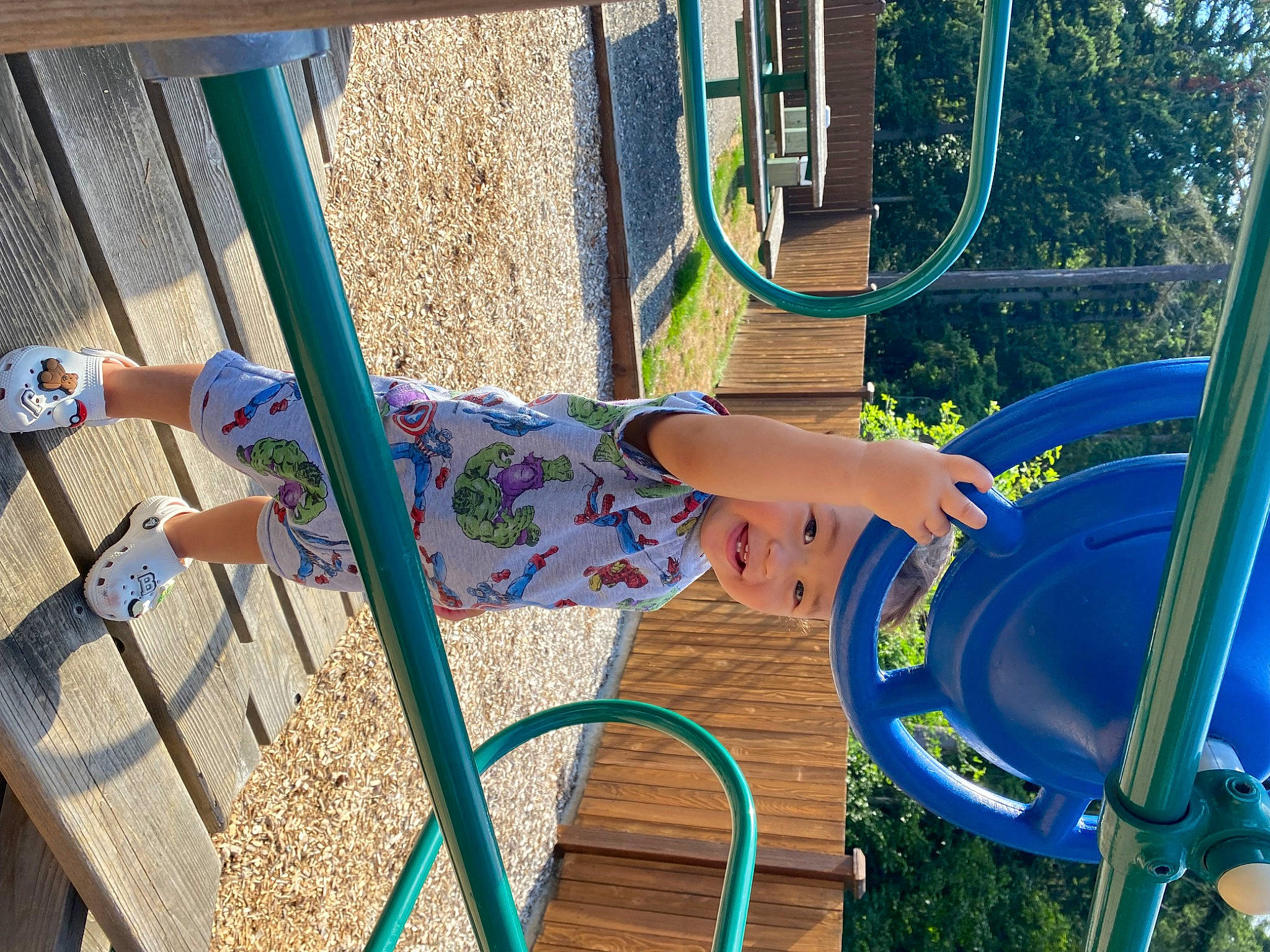 Jaire is registered to the contest to win money with this photo: automotive_tire, azure, blue, chute, city, electric_blue, fun, grass, headwear, human_settlement, leisure, outdoor_play_equipment, person, plant, playground, playground_slide, public_space, recreation, summer, thigh