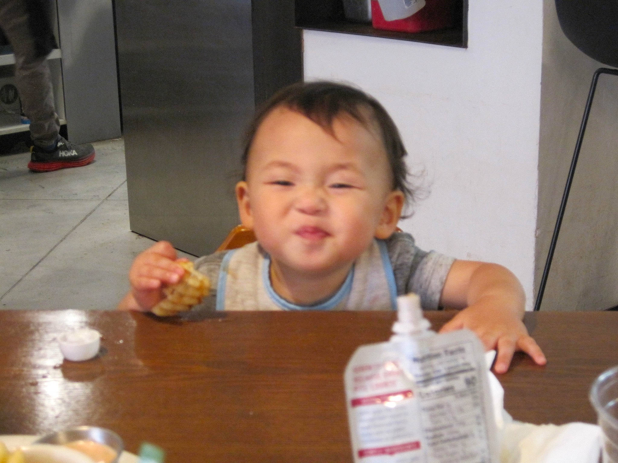 Jaire is registered to the contest to win money with this photo: baby, chair, child, comfort_food, cuisine, finger, food, food_craving, fun, hand, person, picture_frame, play, room, sharing, smile, snapshot, table, tableware, thumb