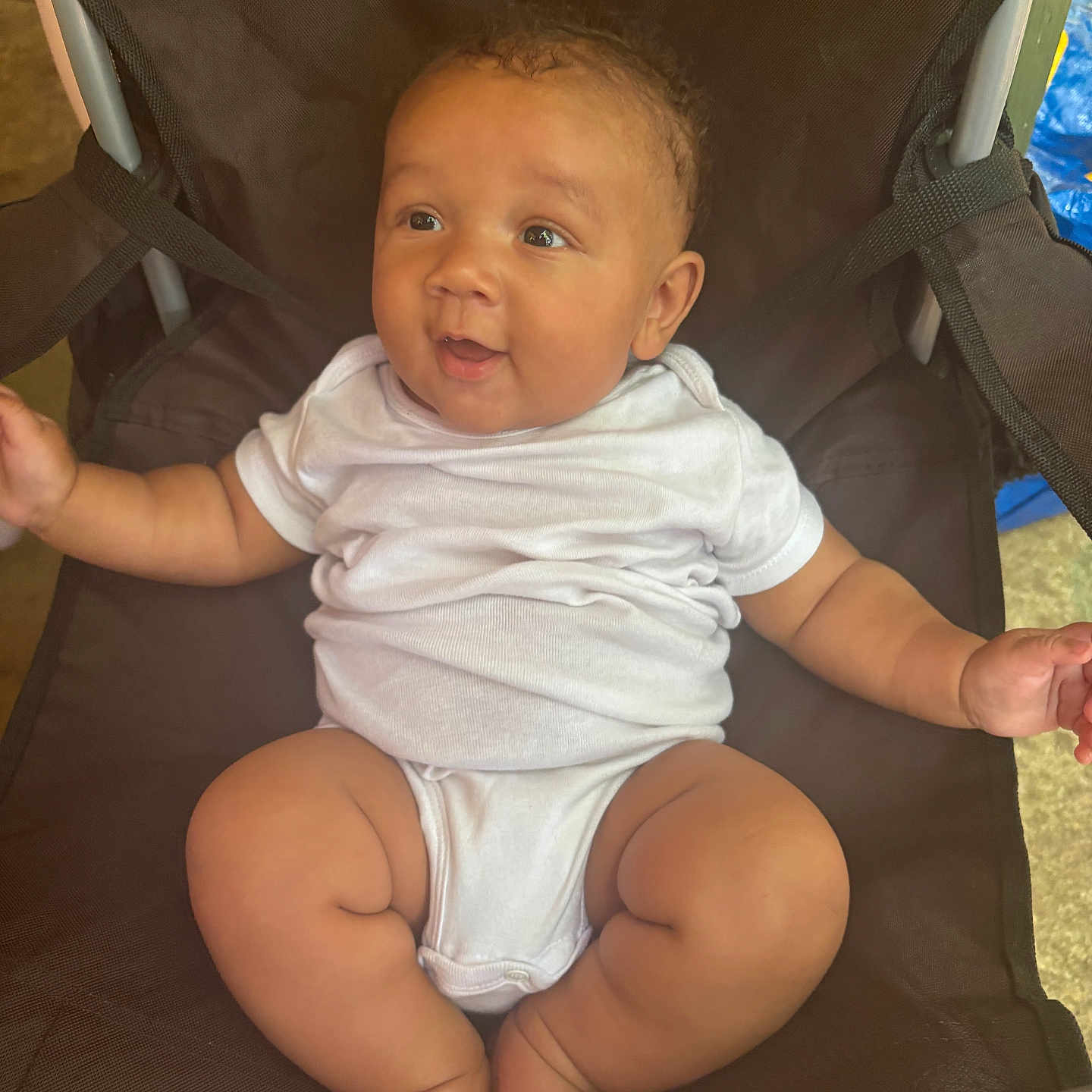 Jasai joined the competition — help win amazing prizes! arm, baby, chair, child, comfort, curly_hair, cute, expression, foot, furniture, happy, indoors, infant, leg, onesie, person, relaxed, sitting, skin, smiling