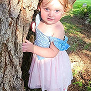 Sarah is registered to the contest to win money with this photo: child, curious, daylight, dress, face, grass, ground, innocent, nature, outdoor, park, person, playful, shoes, smile, standing, sunlight, toddler, tree, young