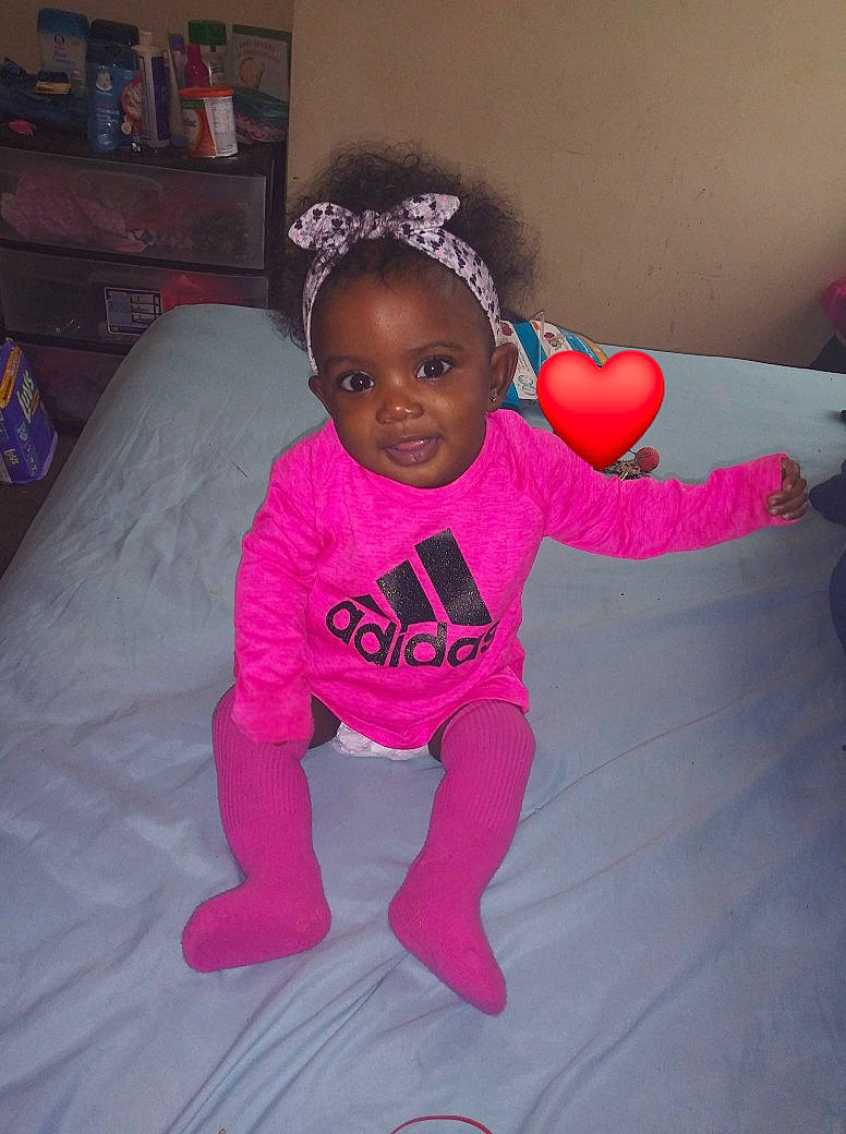 Alaysia is registered to the contest to win money with this photo: baby, baby_toddler_clothing, child, face, fun, hair_accessory, head, person, pink, play, skin, smile, toddler