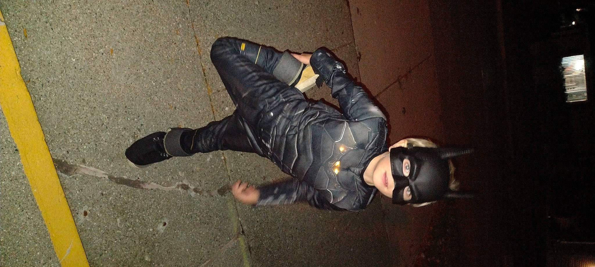 Bentley is registered to the contest to win money with this photo: art, boot, costume, darkness, entertainment, event, flash_photography, flooring, fun, glove, human_leg, knee, latex, leather, leather_jacket, performing_arts, person, personal_protective_equipment, sitting, spandex