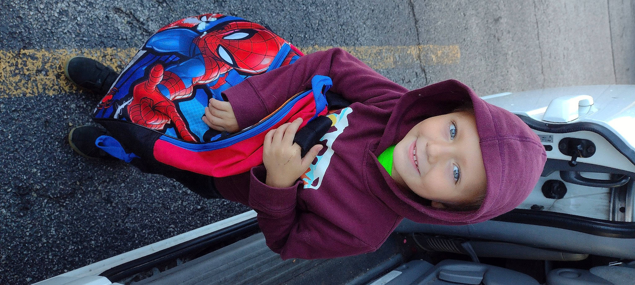 Bentley joined the competition — help win amazing prizes! art, child, electric_blue, fashion_accessory, fun, grass, headgear, headwear, jacket, joy, leisure, magenta, outerwear, person, pink, purple, recreation, sitting, smile, street