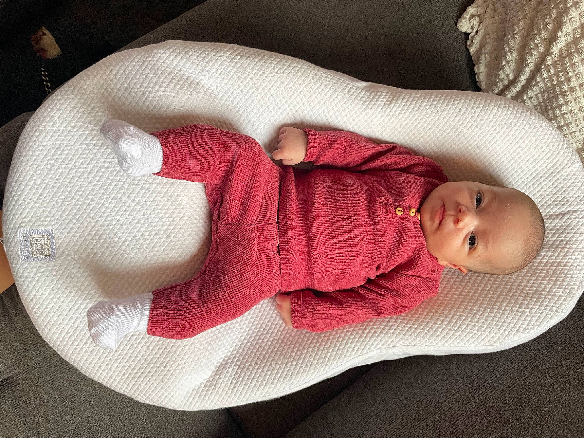 Cassie participe au concours pour gagner de l'argent avec cette photo : arm, baby, baby_sleeping, baby_toddler_clothing, cheek, comfort, facial_expression, finger, hand, human_body, leg, linens, mouth, pattern, person, pink, skin, sleeve, textile, thigh