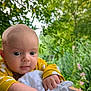 baby, blanket, child, closeup, cute, expression, face, flora, garden, greenery, hands, infant, nature, outdoor, peaceful, portrait, skin, soft_light, yellow_clothing, young