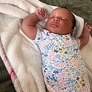 Azaleah joined the competition — help win amazing prizes! arms_stretched, baby, blanket, child, cozy, cute, floral_pattern, head, indoors, infant, newborn, onesie, peaceful, person, portrait, resting, skin, sleep, sleeping, soft_texture