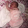 Azaleah is registered to the contest to win money with this photo: baby, blanket, chevron_pattern, child, cozy, crib, cute, indoors, infant, mattress, newborn, patterned_bedding, peaceful, pink, resting, sleeping, soft_texture, toddler, white_fleece, wrapped